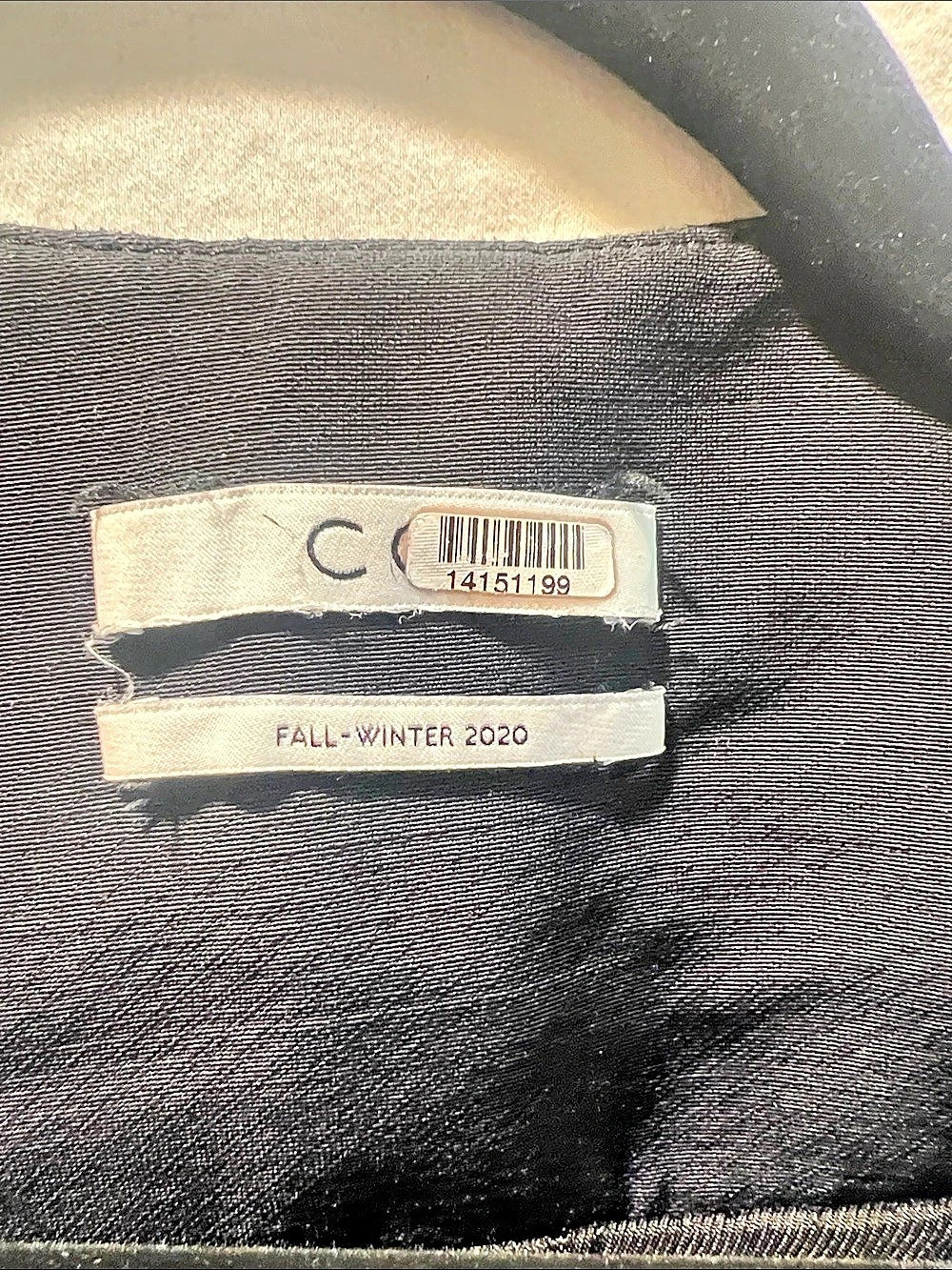 CO Asymmetric button front cropped jacket.