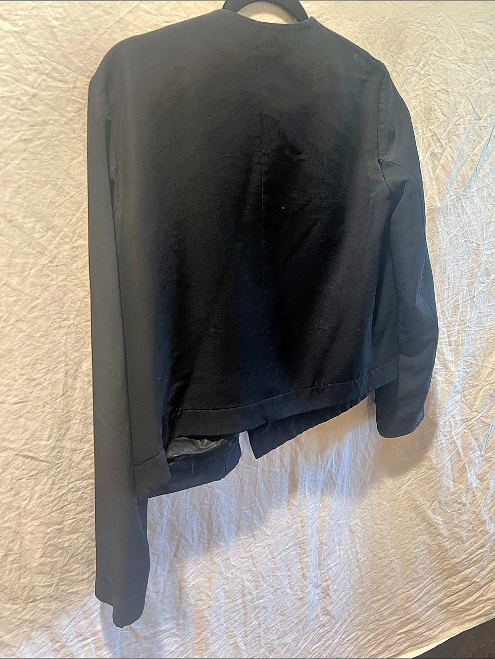 CO Asymmetric button front cropped jacket.